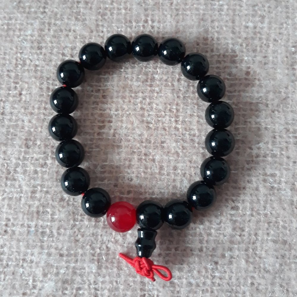 Beaded Zen Bracelet -- Black Beads (with one Red Bead) on Red Elastic